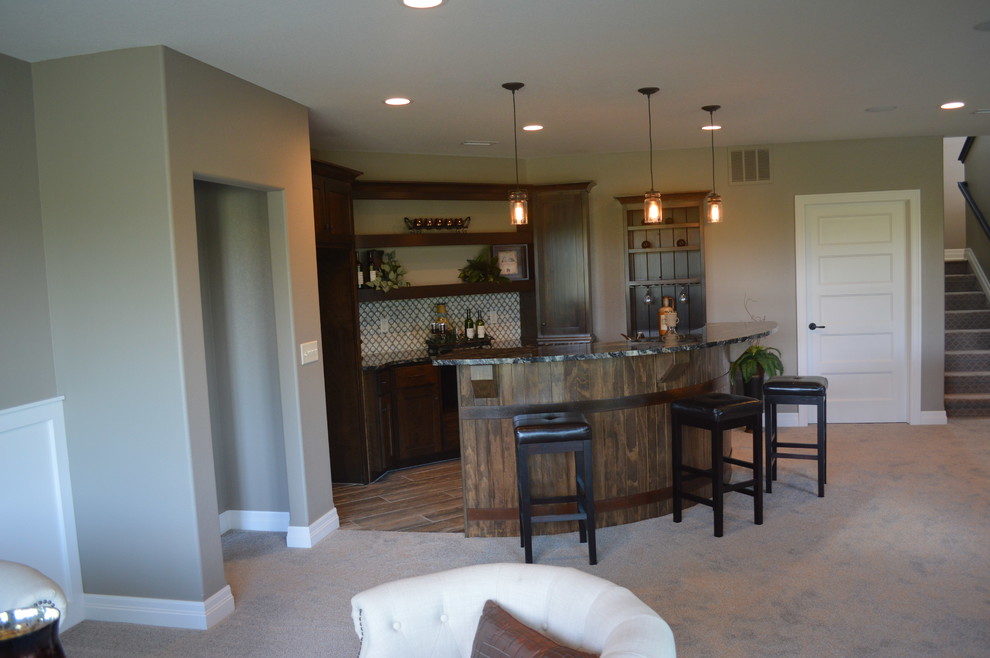 Example of a large classic galley light wood floor seated home bar design in Wichita with shaker cabinets, dark wood cabinets, granite countertops, white backsplash and mosaic tile backsplash