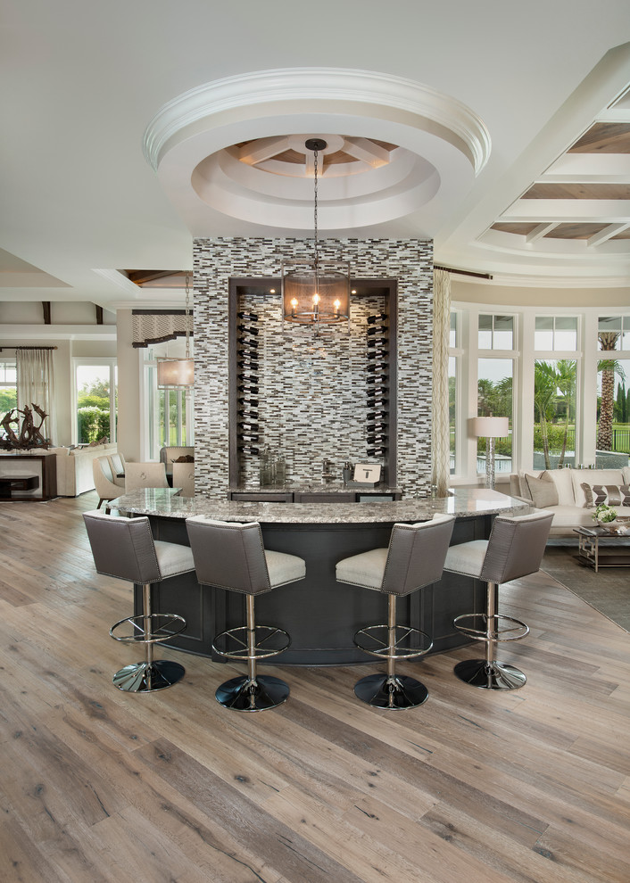 Inspiration for a large transitional home bar remodel in Miami