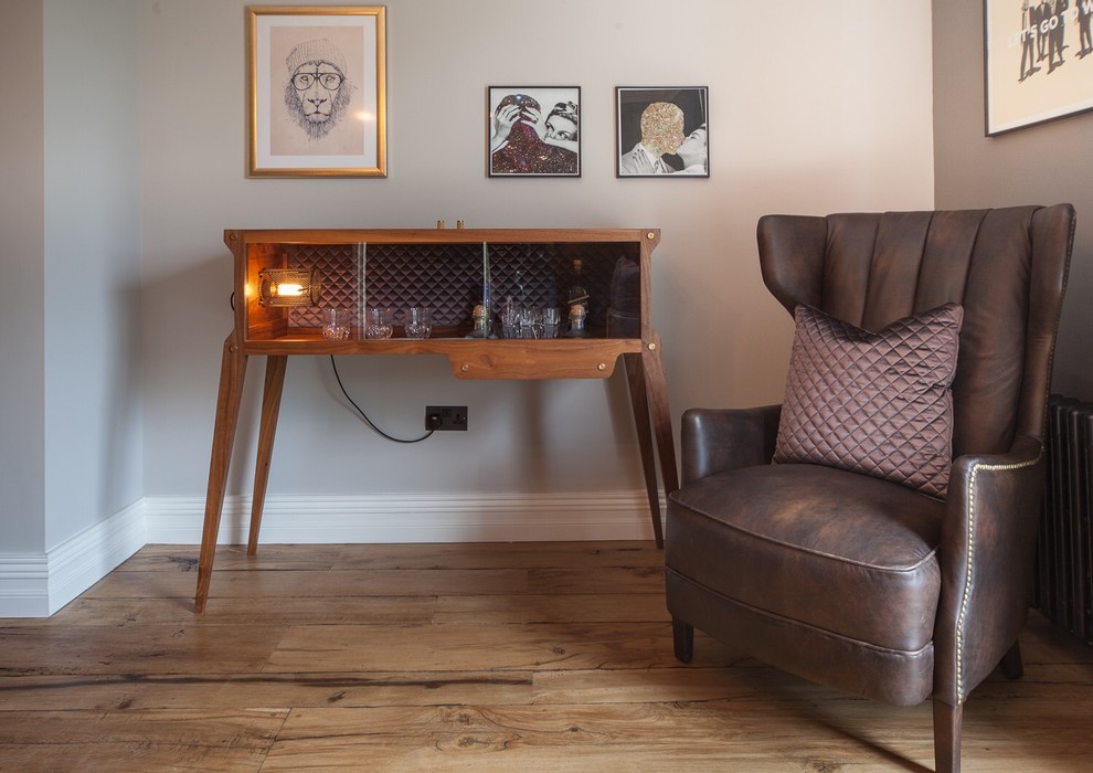 This is an example of a contemporary home bar in Hertfordshire.