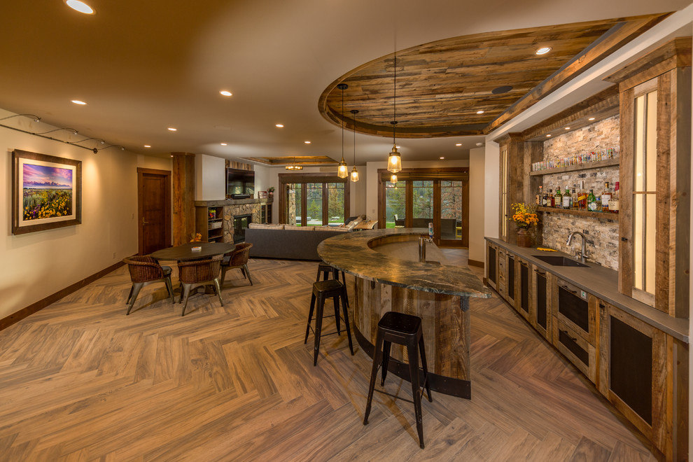 Photo of a medium sized rustic home bar in Denver with medium hardwood flooring and brown floors.