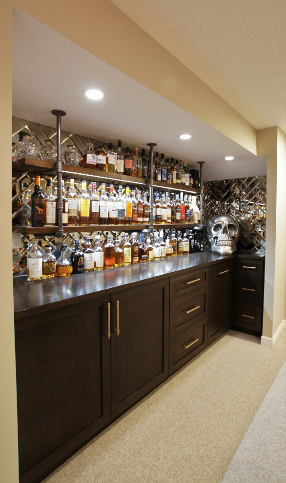 Photo of a small classic single-wall wet bar in Toronto with no sink, shaker cabinets, dark wood cabinets, wood worktops, mirror splashback, carpet, beige floors and brown worktops.
