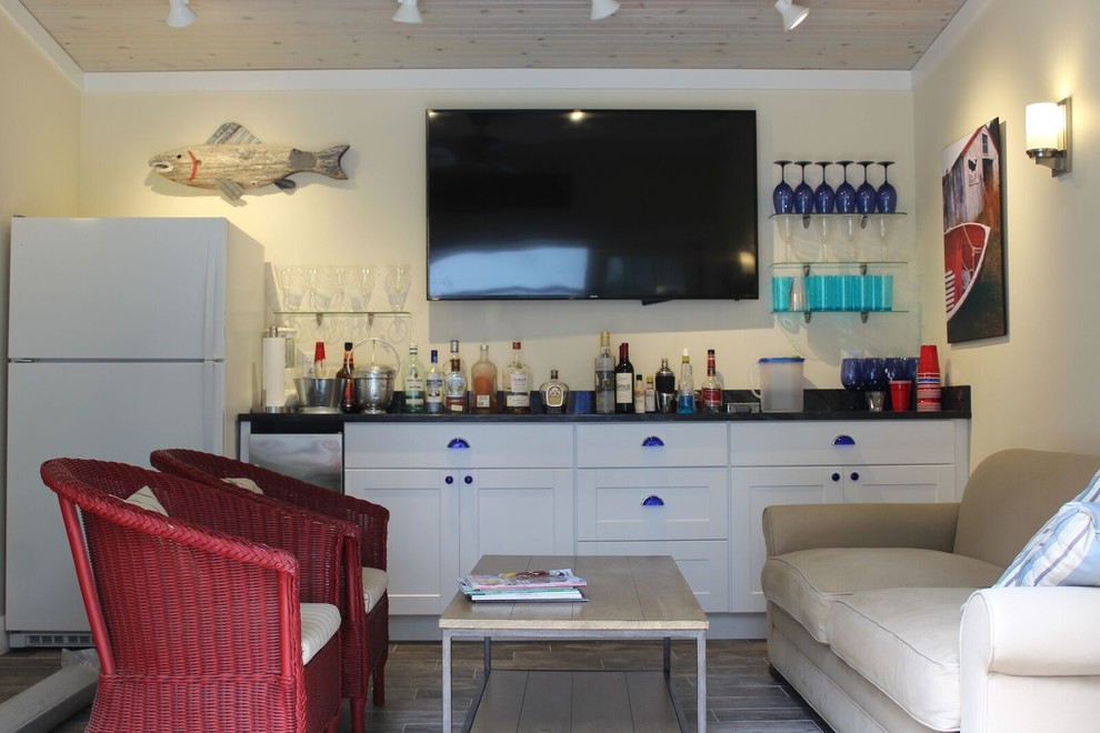 Photo of a coastal home bar in Other.