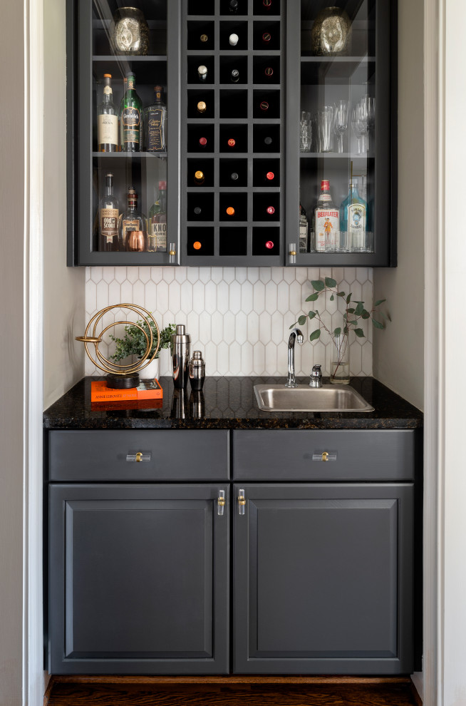 Inspiration for a traditional wet bar in Atlanta with black cabinets, granite worktops, ceramic splashback and black worktops.