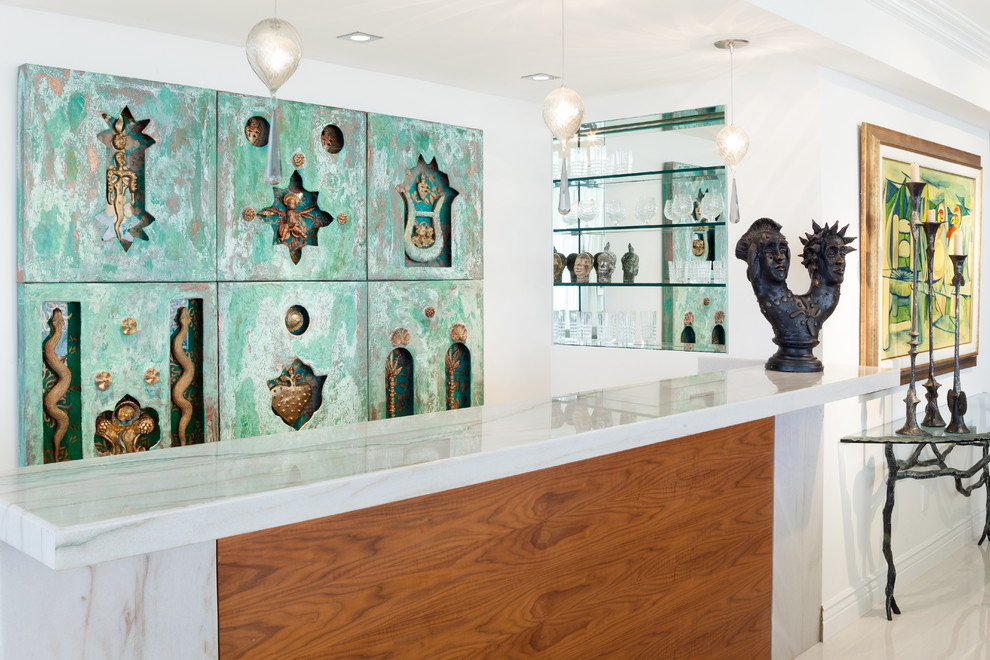 This is an example of a medium sized bohemian single-wall home bar in Miami with porcelain flooring, open cabinets and green splashback.