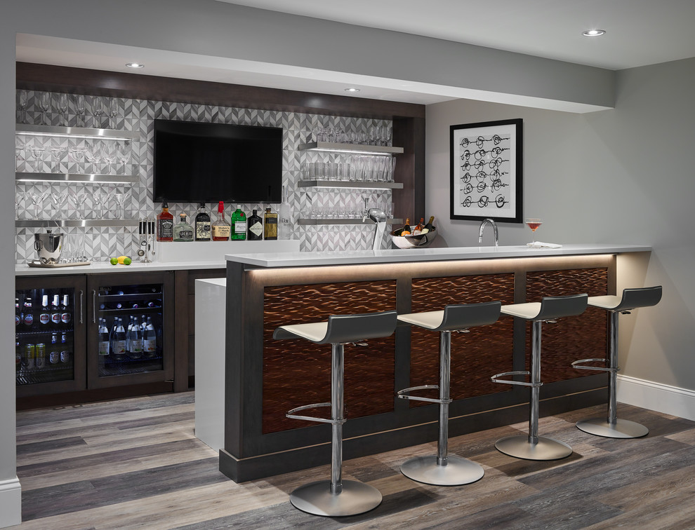 Design ideas for a contemporary galley home bar in Boston with dark wood cabinets, multi-coloured splashback, dark hardwood flooring, brown floors, white worktops, a submerged sink, shaker cabinets, engineered stone countertops and mosaic tiled splashback.