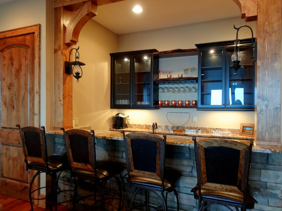 This is an example of a large rustic home bar in Charlotte.