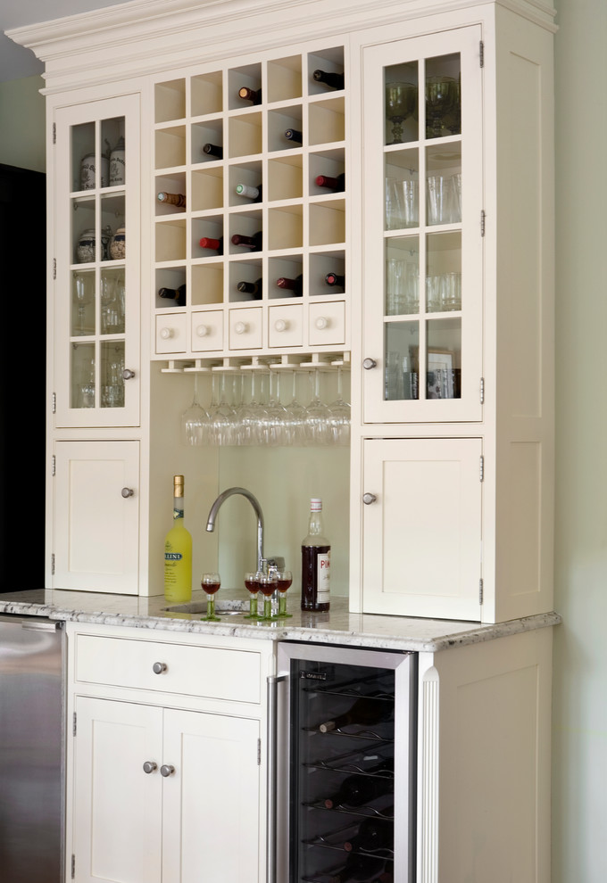 Inspiration for a farmhouse single-wall home bar remodel in Boston with an undermount sink, flat-panel cabinets and white cabinets
