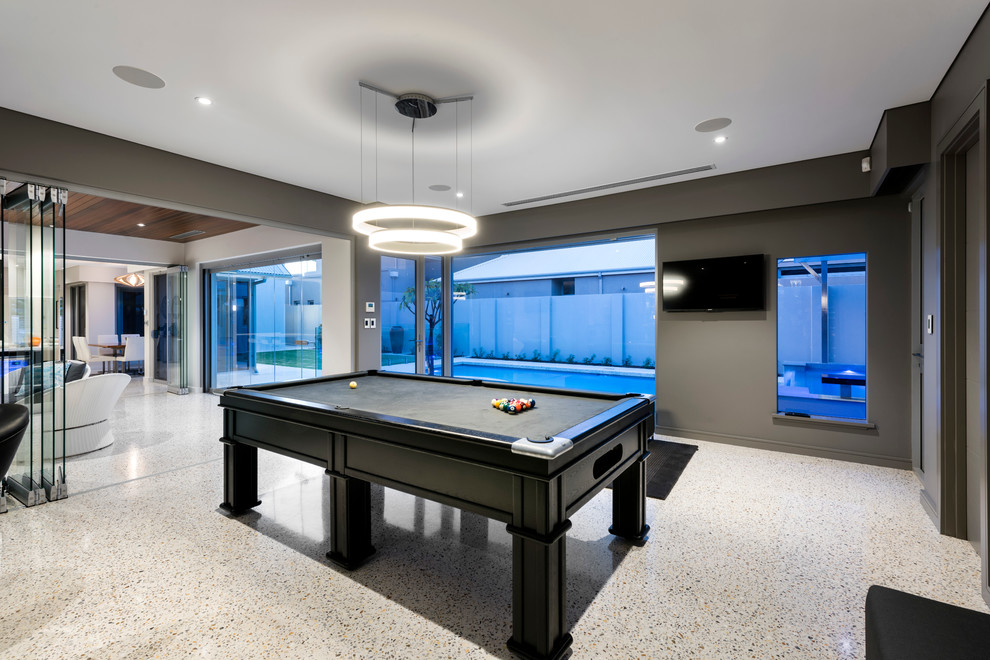 Diseño de bar en casa con barra de bar moderno grande con encimera de cuarzo compacto y suelo de cemento