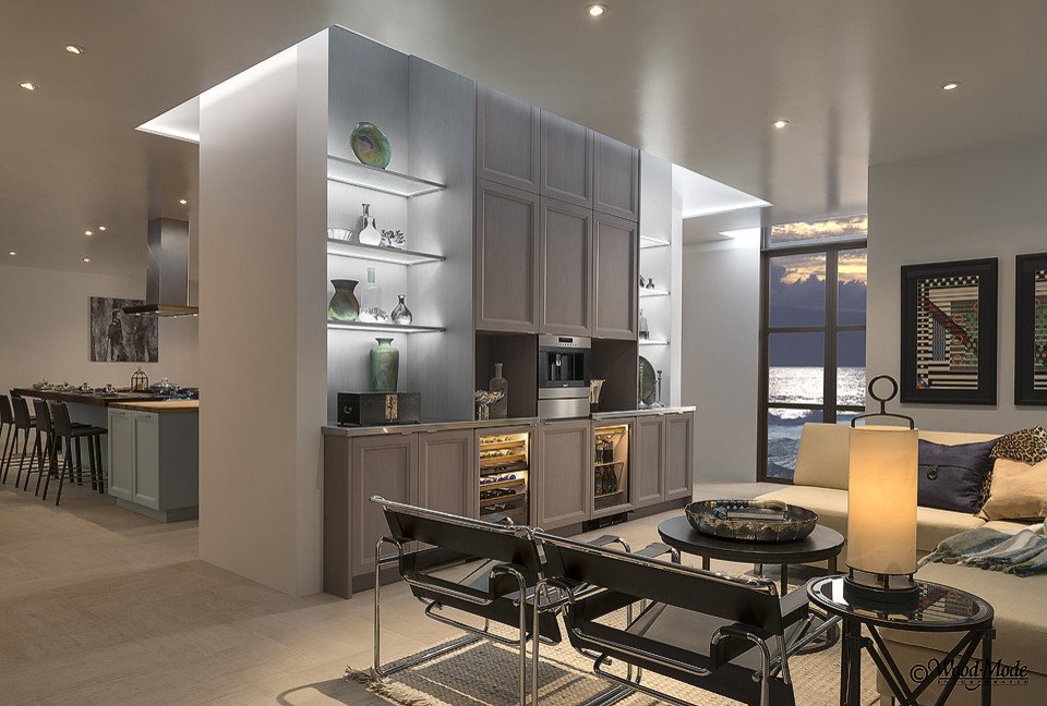 Design ideas for a large contemporary single-wall wet bar in Houston with recessed-panel cabinets, grey cabinets, stainless steel worktops and porcelain flooring.
