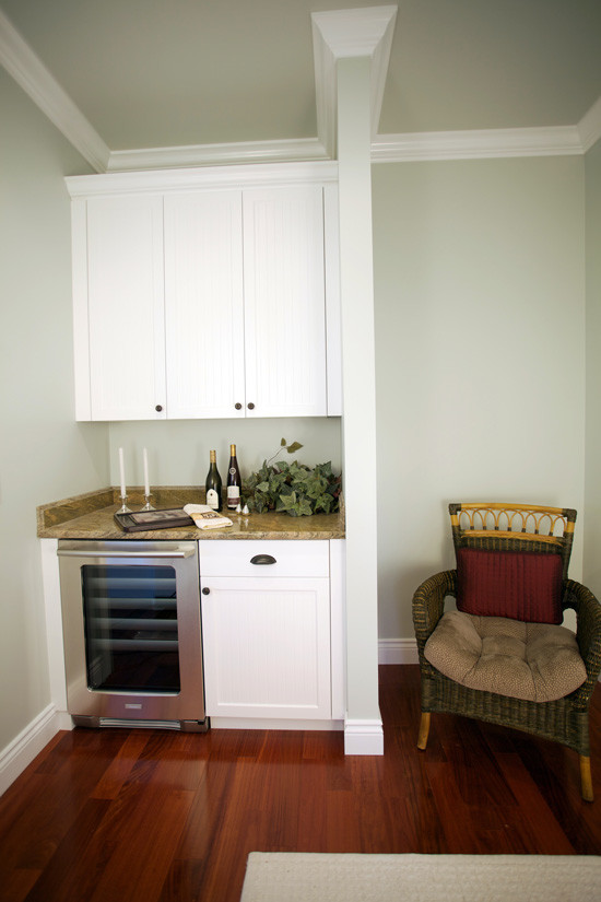 Inspiration for a small contemporary single-wall medium tone wood floor wet bar remodel in Other with no sink, shaker cabinets and white cabinets