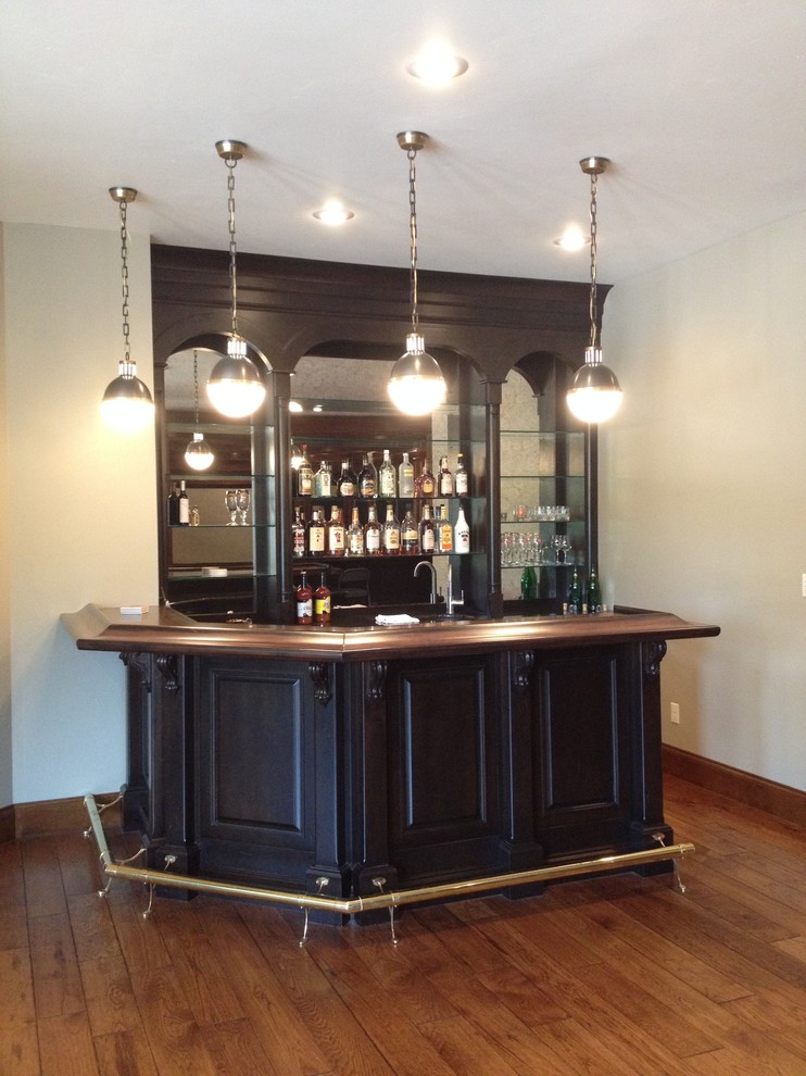 Inspiration for a traditional home bar in Other.