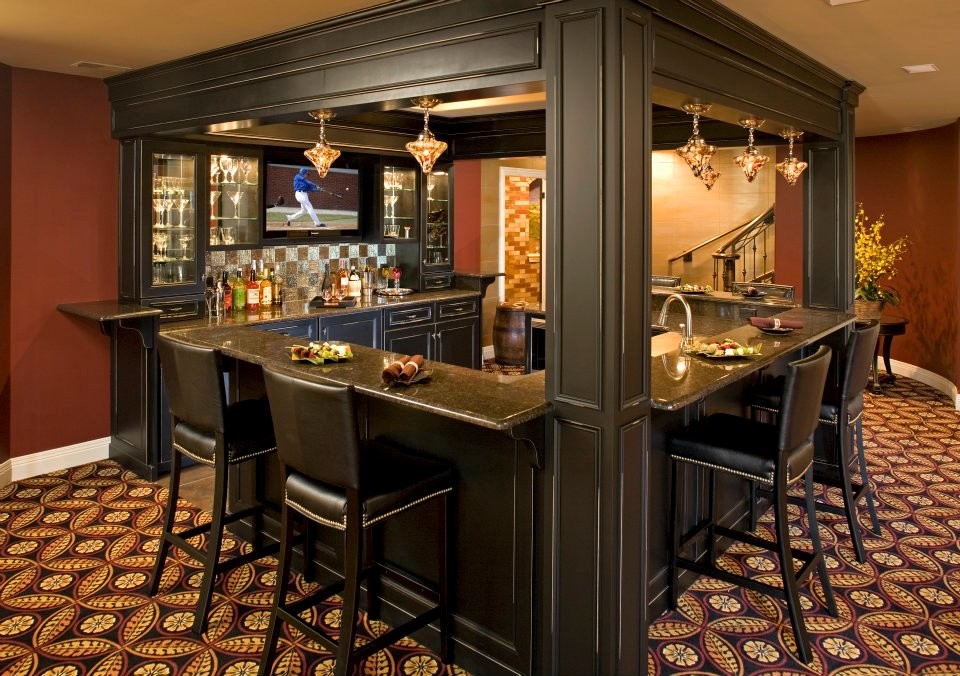 Example of a mid-sized classic galley carpeted and multicolored floor seated home bar design in Chicago with raised-panel cabinets, dark wood cabinets, granite countertops, multicolored backsplash and ceramic backsplash