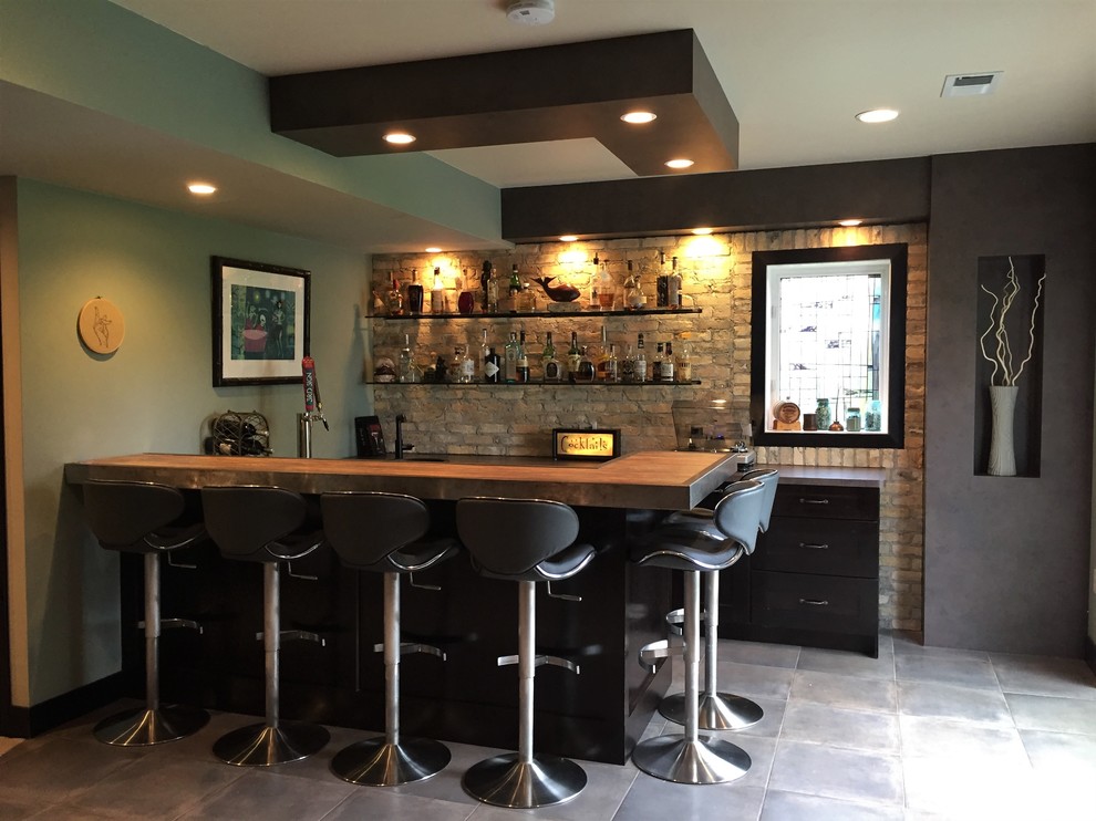 This is an example of an industrial home bar in Other.