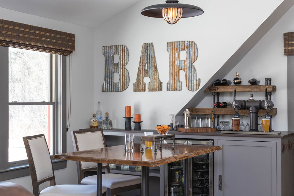 Seated home bar - large rustic single-wall seated home bar idea in Other with shaker cabinets, gray cabinets, white backsplash and brown countertops