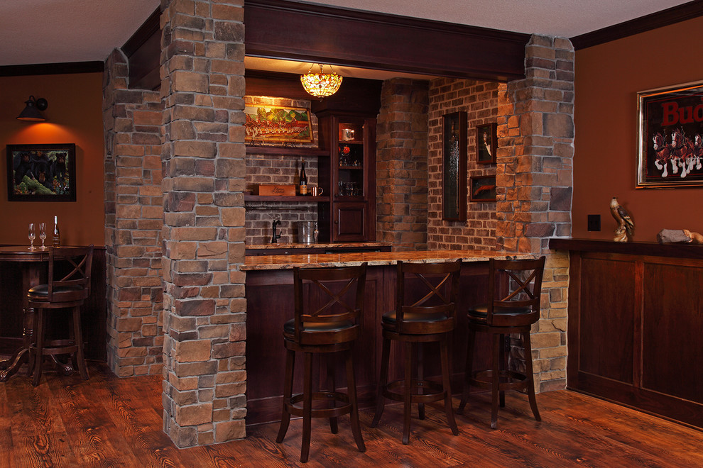 Medium sized rustic home bar in Minneapolis.