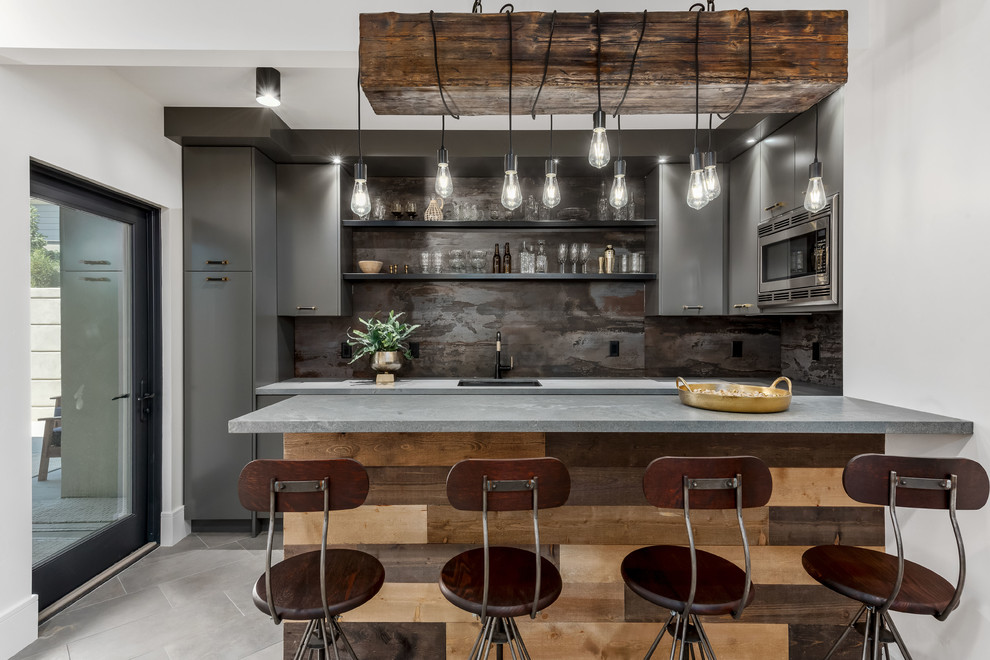Inspiration for a large contemporary u-shaped wet bar in Salt Lake City with a submerged sink, flat-panel cabinets, grey cabinets, quartz worktops, grey splashback, porcelain flooring, grey floors and grey worktops.