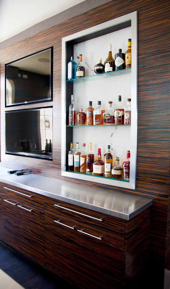 Design ideas for a large contemporary single-wall home bar in Miami with a submerged sink, flat-panel cabinets, dark wood cabinets, stainless steel worktops and dark hardwood flooring.