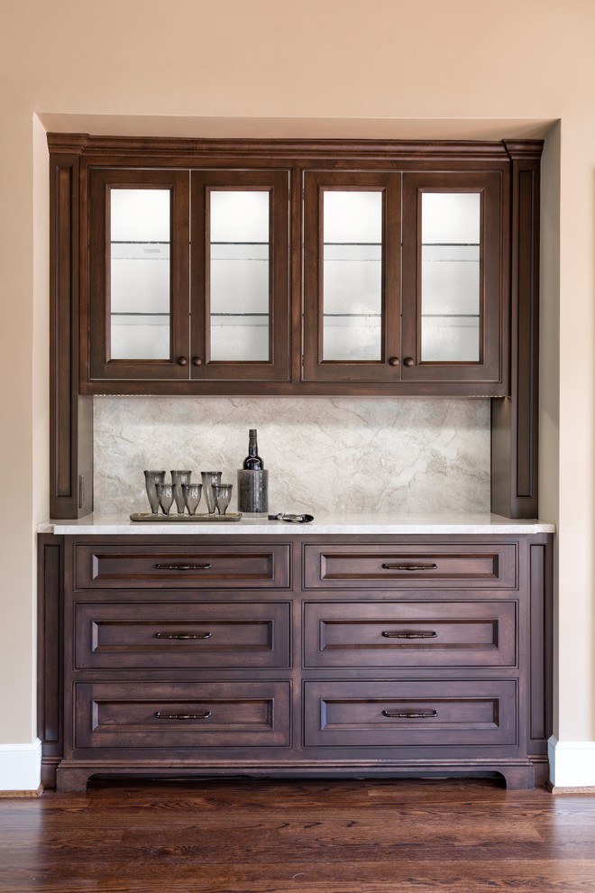 Mid-sized transitional single-wall painted wood floor wet bar photo in Kansas City with recessed-panel cabinets, white cabinets, white backsplash, quartzite countertops, no sink, stone slab backsplash and white countertops