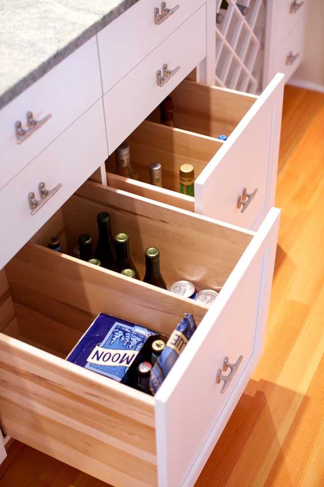 This is an example of a coastal single-wall wet bar in New York with a submerged sink, shaker cabinets, white cabinets, granite worktops and medium hardwood flooring.