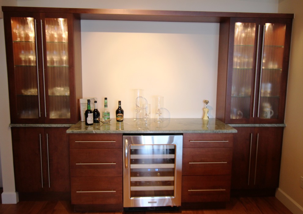 Photo of a contemporary home bar in Miami with glass-front cabinets, dark wood cabinets, quartz worktops and medium hardwood flooring.