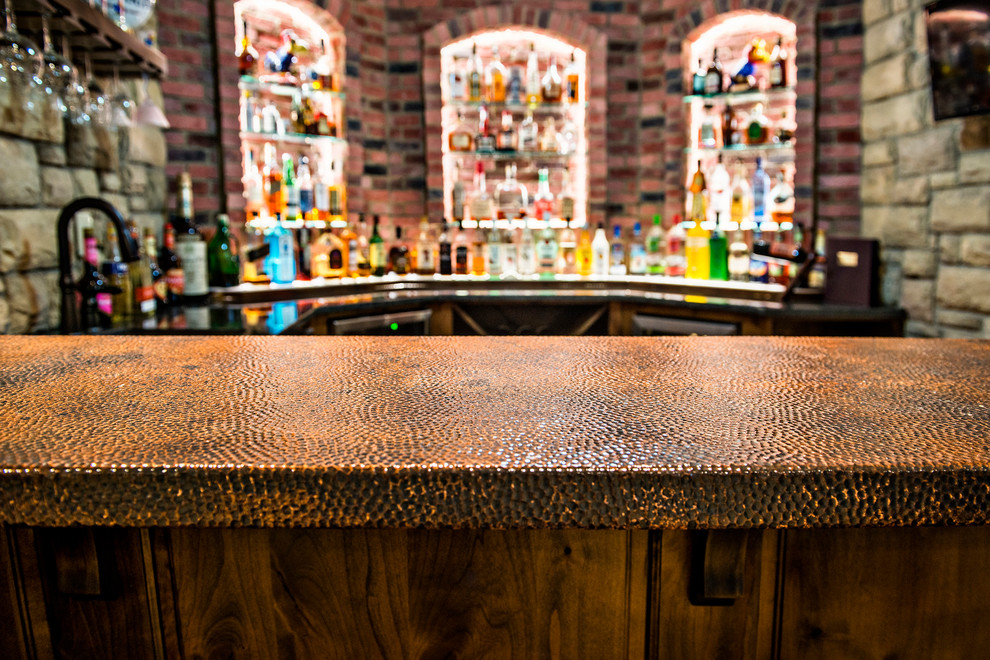 Medium sized rustic u-shaped breakfast bar in Kansas City with brick flooring, red floors, a submerged sink, raised-panel cabinets, dark wood cabinets, red splashback and brown worktops.