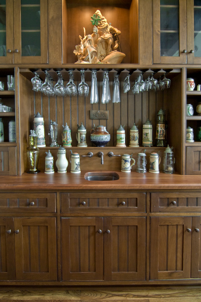 Inspiration for a classic home bar in New York with medium hardwood flooring.