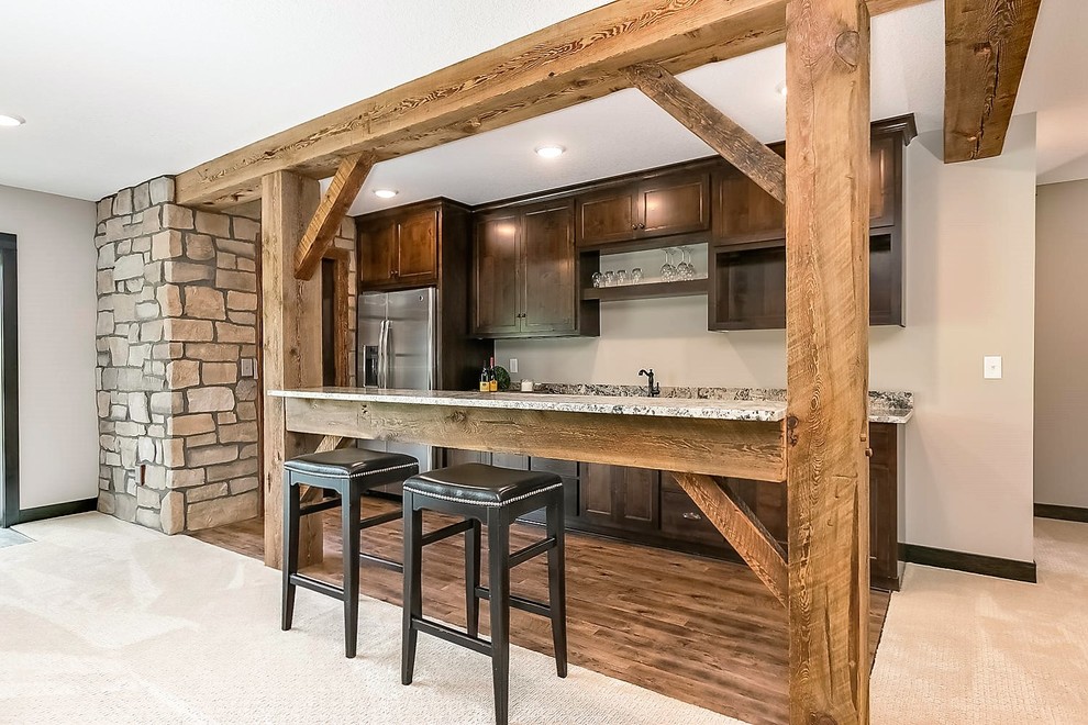 Example of a mountain style home bar design in Minneapolis