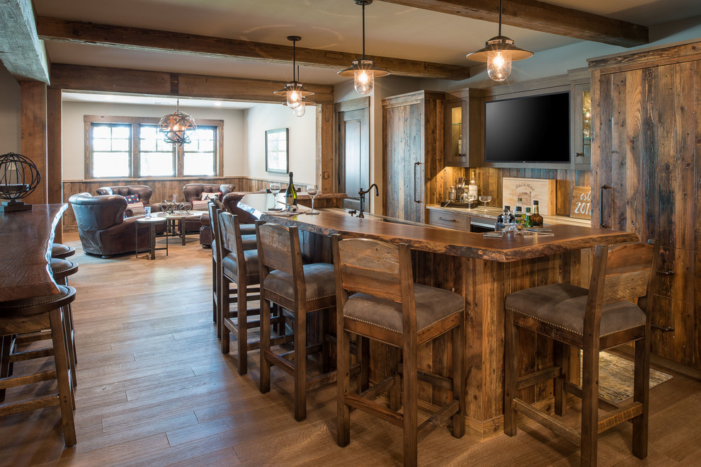 Mountain style galley medium tone wood floor and brown floor wet bar photo in Minneapolis with an undermount sink, flat-panel cabinets, medium tone wood cabinets, wood countertops, brown backsplash, wood backsplash and brown countertops