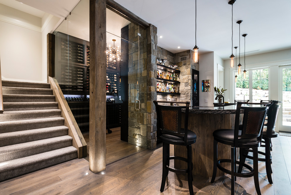 Large traditional single-wall breakfast bar in Vancouver with granite worktops, multi-coloured splashback, stone tiled splashback, medium hardwood flooring and brown floors.