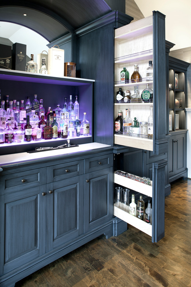 Photo of an expansive traditional single-wall home bar in Baltimore with a submerged sink, grey cabinets and medium hardwood flooring.