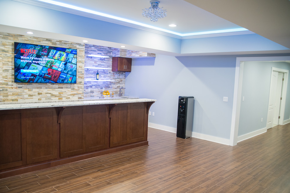 Large trendy galley porcelain tile wet bar photo in New York with an undermount sink, shaker cabinets, dark wood cabinets, granite countertops, multicolored backsplash and stone tile backsplash