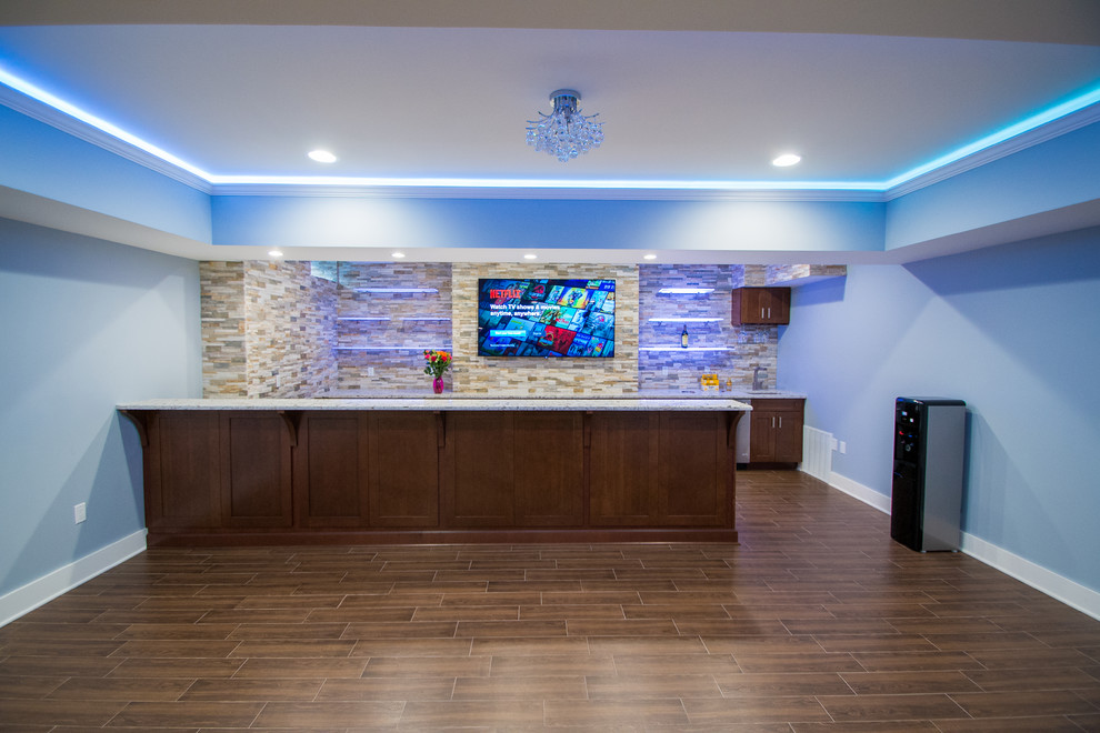 Example of a large trendy galley porcelain tile wet bar design in New York with an undermount sink, shaker cabinets, dark wood cabinets, granite countertops, multicolored backsplash and stone tile backsplash
