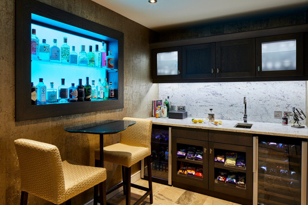 This is an example of a small contemporary single-wall wet bar in West Midlands with an integrated sink, open cabinets, dark wood cabinets, granite worktops, white splashback, granite splashback, ceramic flooring, beige floors and grey worktops.