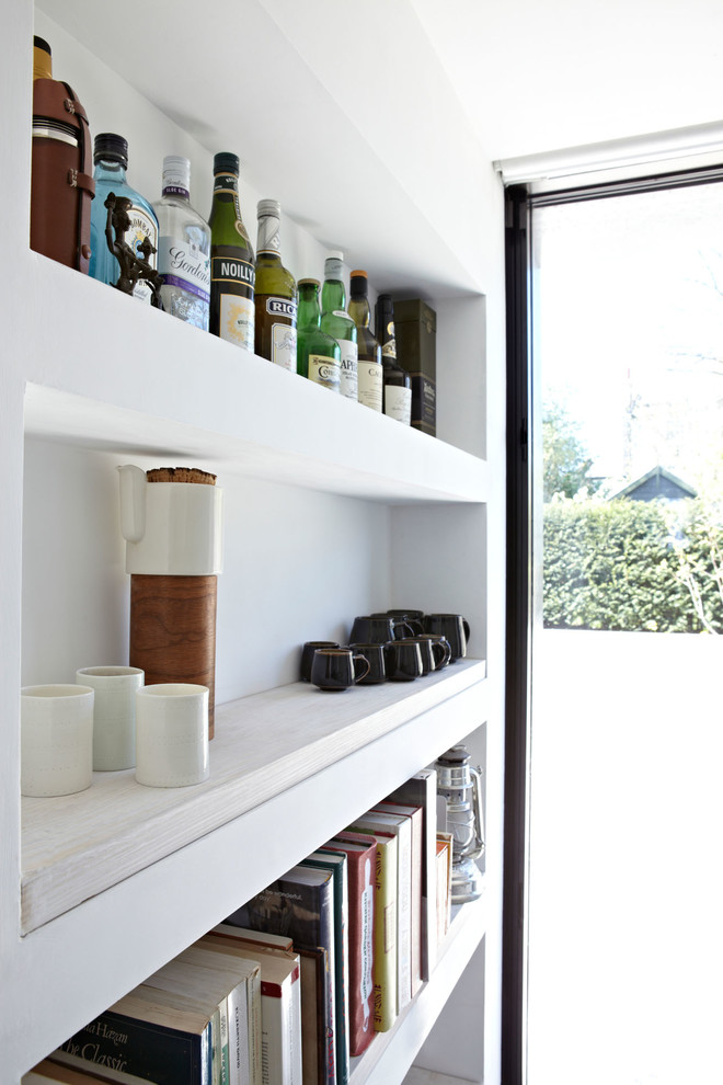 Example of a trendy home bar design in London