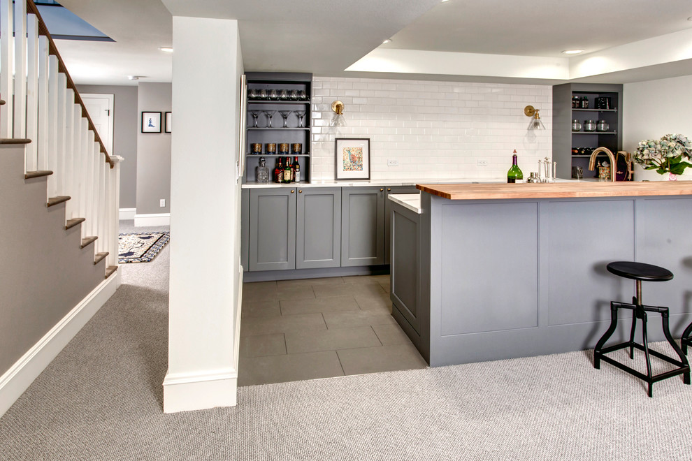 Inspiration for a classic galley breakfast bar in Seattle with a submerged sink, shaker cabinets, grey cabinets, marble worktops, white splashback, metro tiled splashback, ceramic flooring and grey floors.