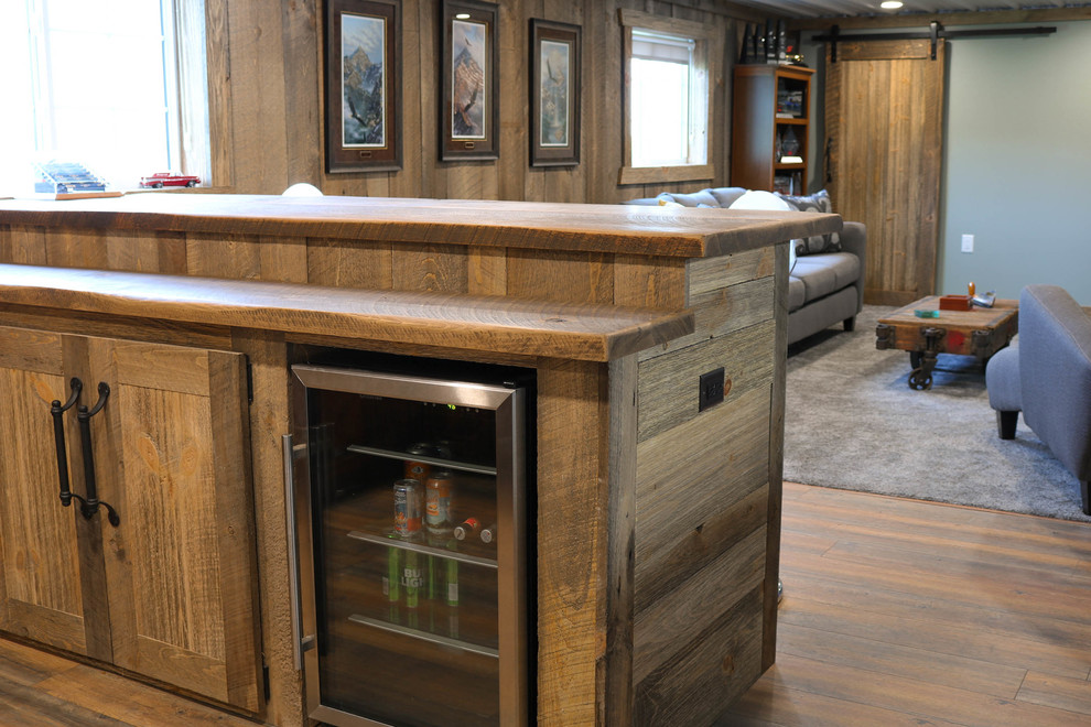 Photo of a medium sized rustic galley breakfast bar in Minneapolis with a built-in sink, raised-panel cabinets, light wood cabinets, wood worktops, wood splashback and brown worktops.