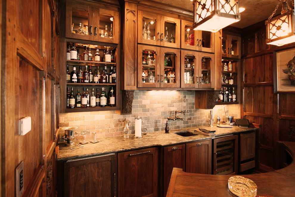 Design ideas for a large traditional home bar in Charlotte with dark hardwood flooring.