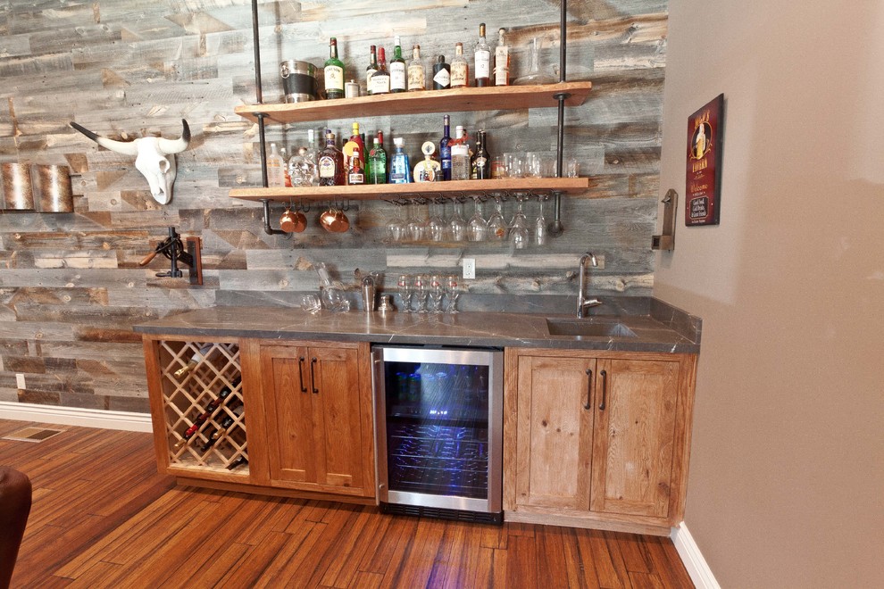 This is an example of a medium sized classic single-wall wet bar in San Francisco with a submerged sink, medium wood cabinets, marble worktops, bamboo flooring and shaker cabinets.