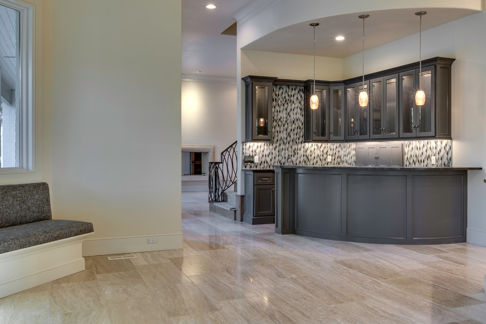 This is an example of a traditional l-shaped breakfast bar in Oklahoma City with glass-front cabinets, grey cabinets and multi-coloured splashback.