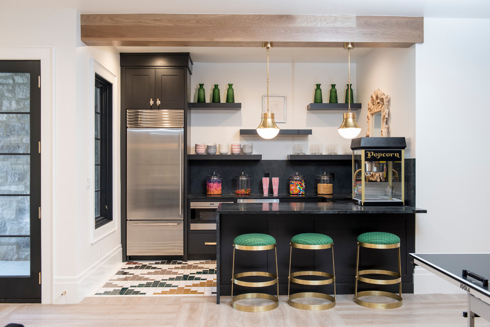 Photo of a contemporary u-shaped breakfast bar in Salt Lake City with shaker cabinets, black cabinets, black splashback, ceramic flooring and multi-coloured floors.