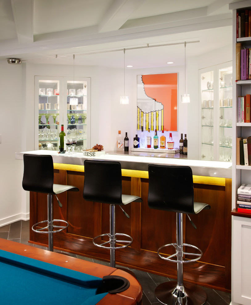 This is an example of a small midcentury single-wall breakfast bar in Other with open cabinets, white cabinets, glass worktops, dark hardwood flooring and brown floors.
