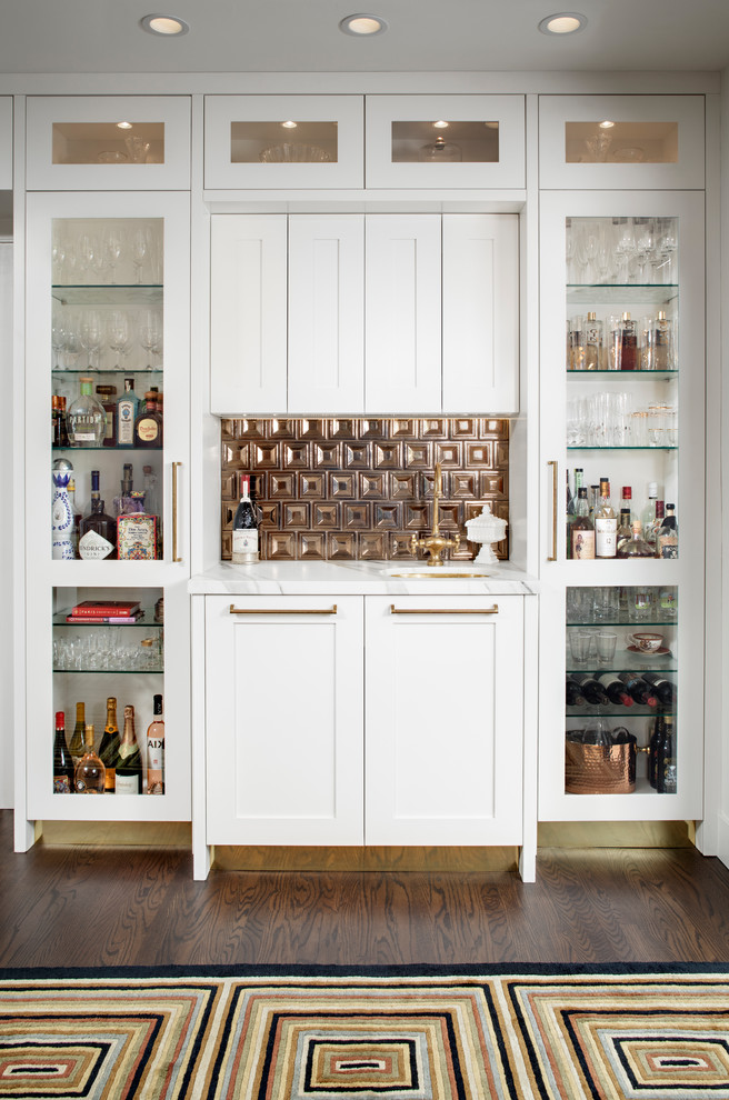 Small classic single-wall wet bar in San Diego with shaker cabinets, white cabinets, marble worktops, brown floors, a submerged sink, brown splashback, metal splashback, dark hardwood flooring and white worktops.