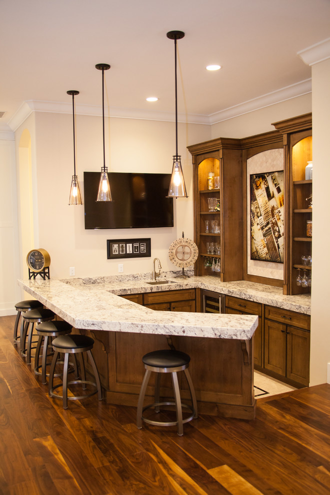Modern u-shaped breakfast bar in Salt Lake City with a submerged sink, shaker cabinets and medium wood cabinets.