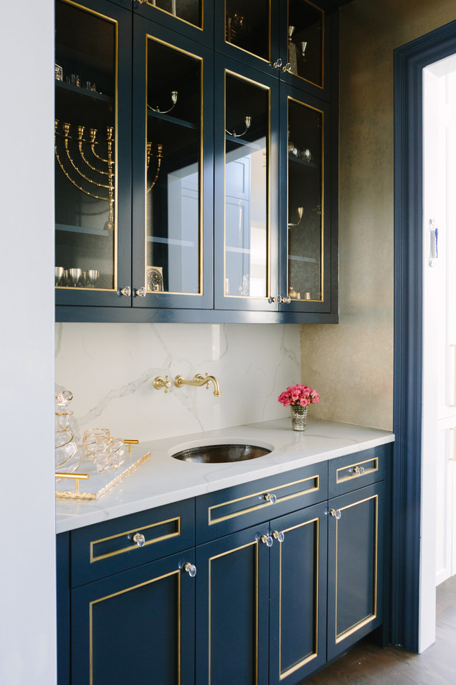 This is an example of a medium sized classic single-wall wet bar in Chicago with a submerged sink, beaded cabinets, blue cabinets, tile countertops, white splashback, porcelain splashback, dark hardwood flooring, brown floors and white worktops.