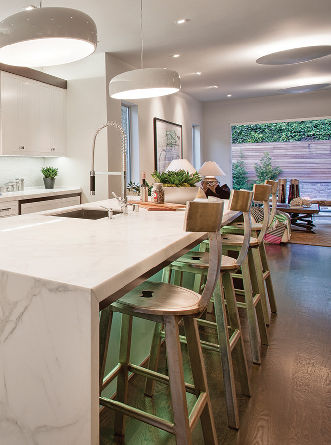 Mid-sized trendy medium tone wood floor seated home bar photo in San Francisco with white cabinets and marble countertops