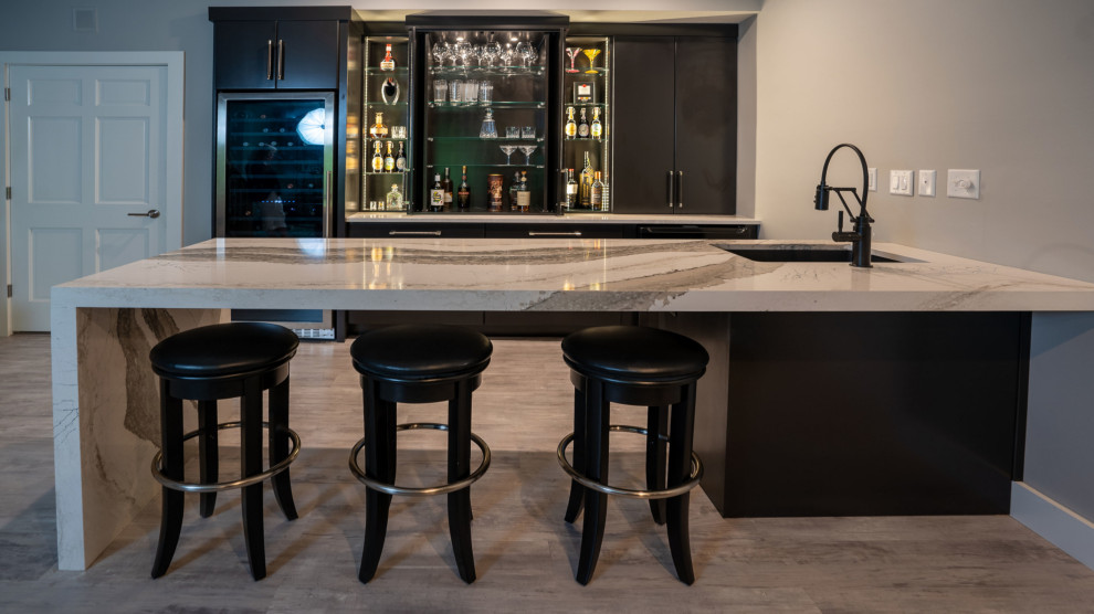 Design ideas for a medium sized contemporary single-wall wet bar in Other with a submerged sink, black cabinets, engineered stone countertops, vinyl flooring, grey floors and multicoloured worktops.