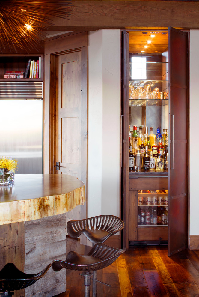 This is an example of a contemporary home bar in Denver.