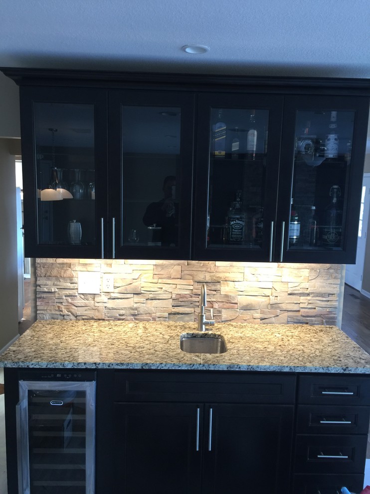 Inspiration for a small contemporary dark wood floor and brown floor wet bar remodel in Other with an undermount sink, raised-panel cabinets, white cabinets, granite countertops and multicolored backsplash