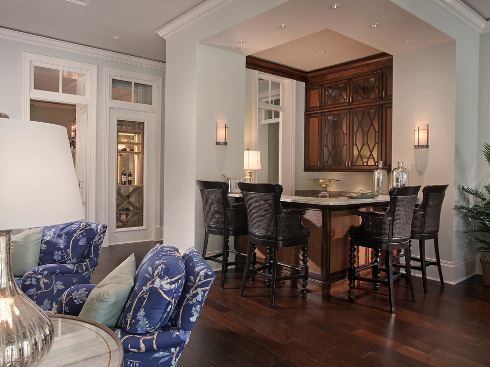 Example of an island style home bar design in Miami