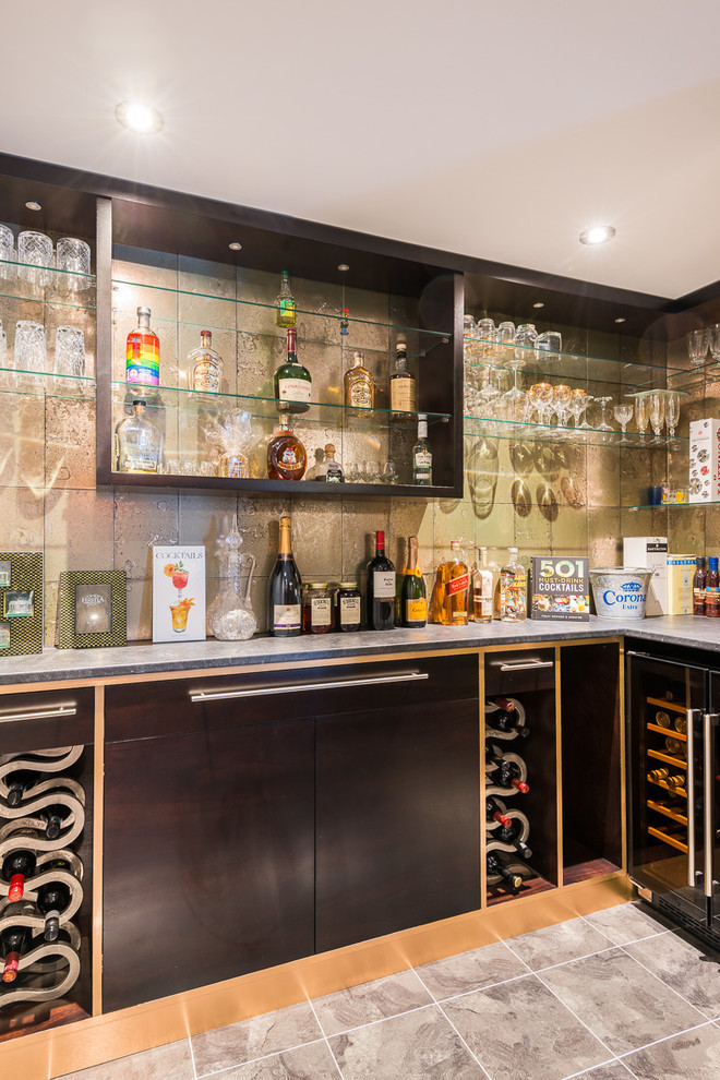 Inspiration for a small contemporary l-shaped home bar in London with flat-panel cabinets, grey floors, grey worktops, brown cabinets and beige splashback.